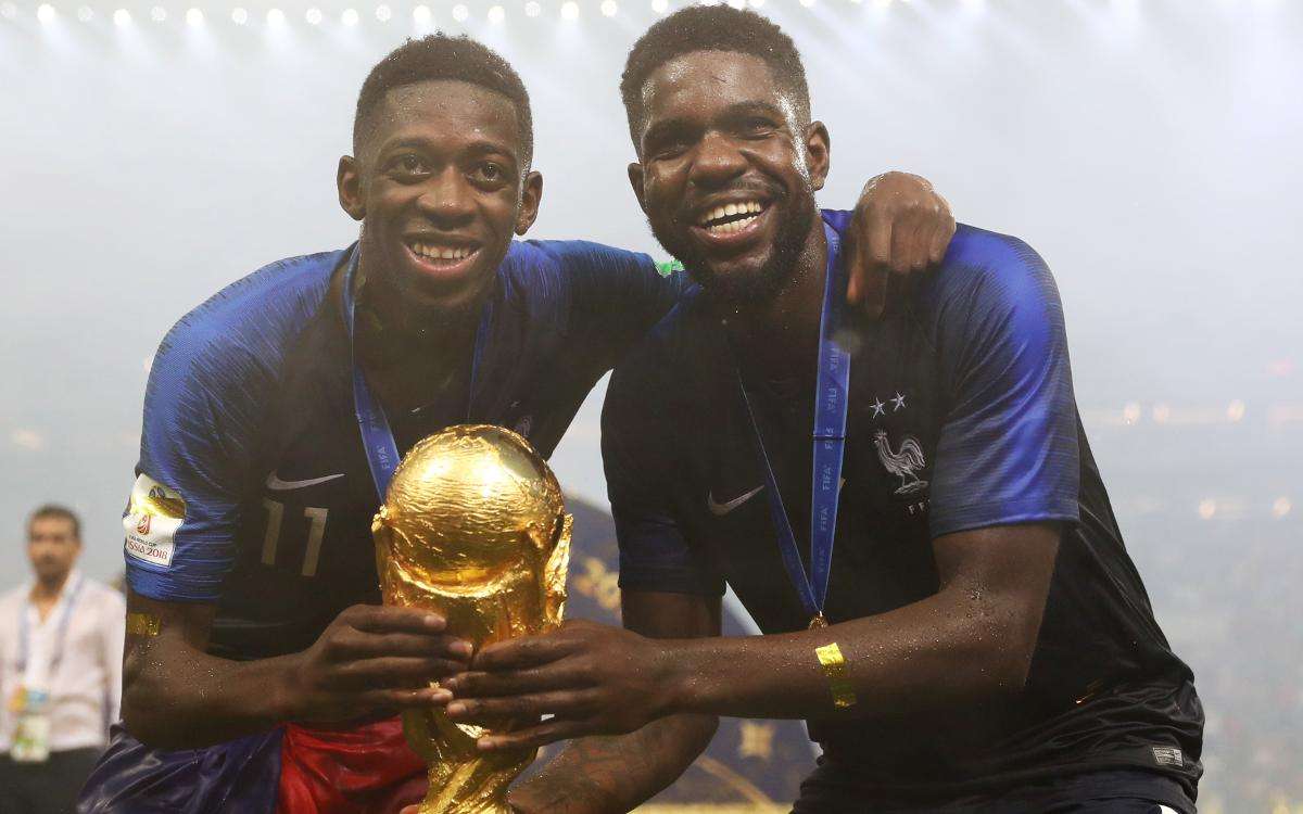 Ousmane Dembele and Umtiti of France with World Cup trophy