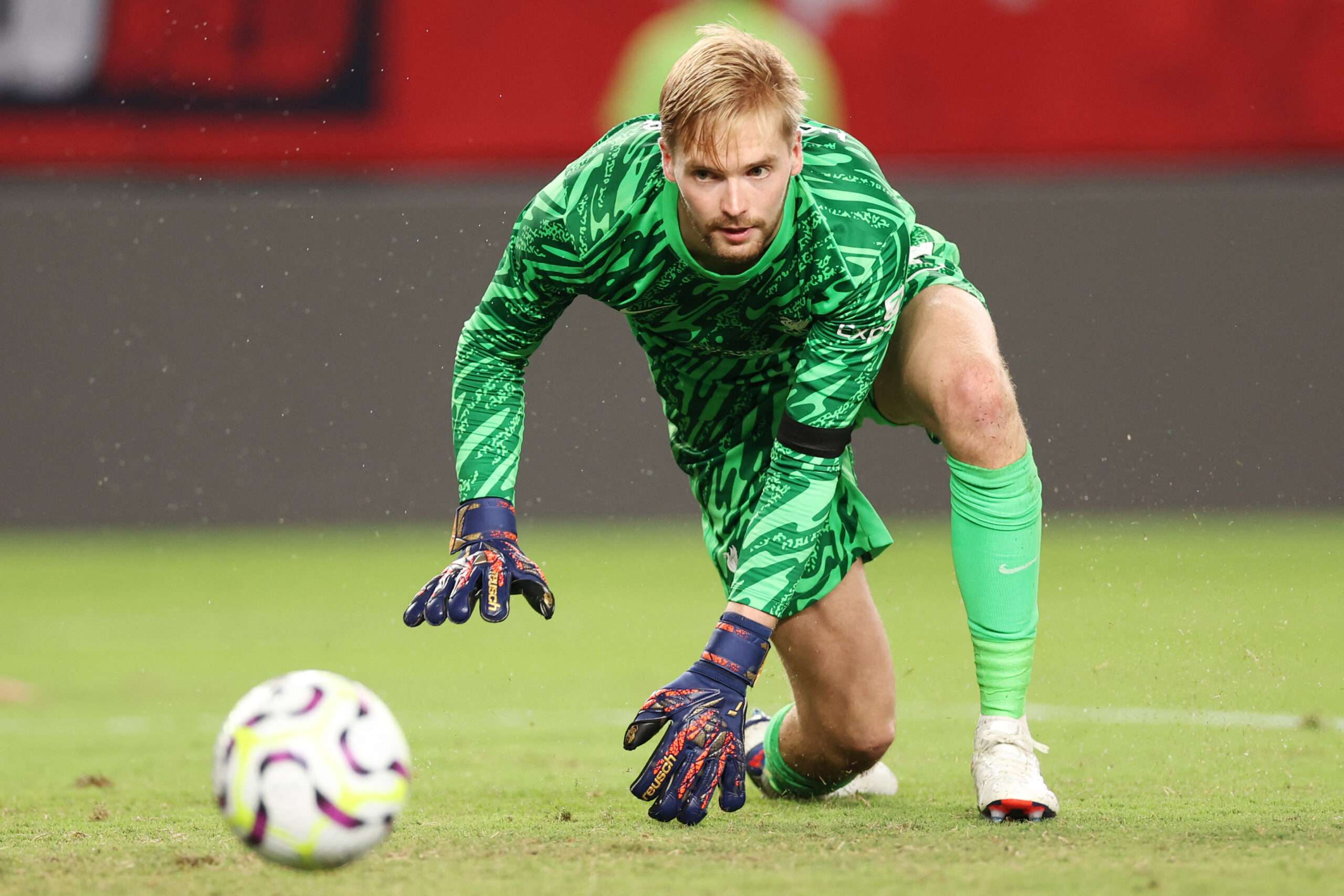 Caoimhín Kelleher Liverpool's Irish goalkeeper #62 Caoimhin Kelleher looks at the ball during the pre-season club friendly football match between Arsenal FC and Liverpool FC at Lincoln Financial Field in Philadelphia, Pennsylvania, on July 31, 2024. (Photo by Charly TRIBALLEAU / AFP) (Photo by CHARLY TRIBALLEAU/AFP via Getty Images)