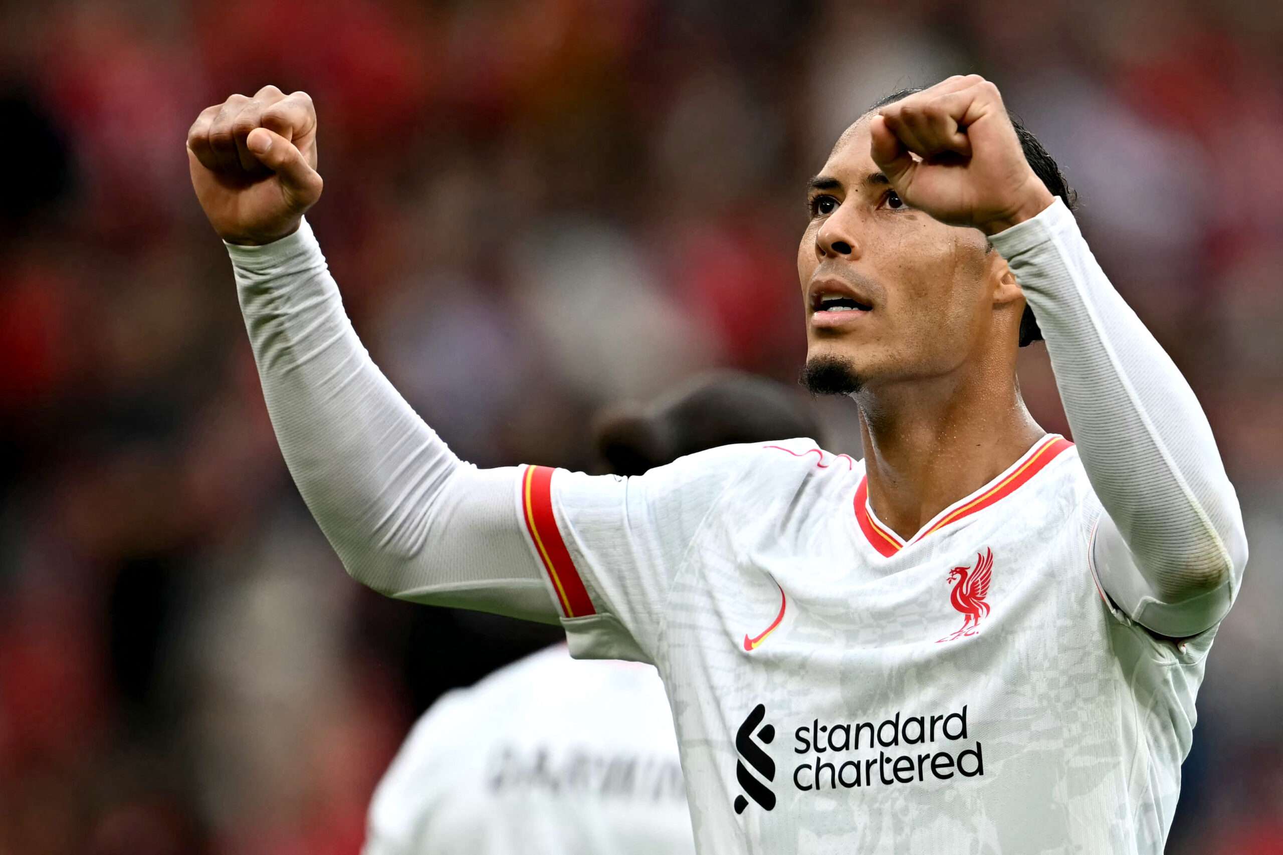 Liverpool's Dutch defender #04 Virgil van Dijk reacts after the English Premier League football match between Manchester United and Liverpool at Old Trafford in Manchester, north west England, on September 1, 2024. Manchester United 0 Liverpool 3 (Photo by Paul ELLIS / AFP) / RESTRICTED TO EDITORIAL USE. No use with unauthorized audio, video, data, fixture lists, club/league logos or 'live' services. Online in-match use limited to 120 images. An additional 40 images may be used in extra time. No video emulation. Social media in-match use limited to 120 images. An additional 40 images may be used in extra time. No use in betting publications, games or single club/league/player publications. / (Photo by PAUL ELLIS/AFP via Getty Images)