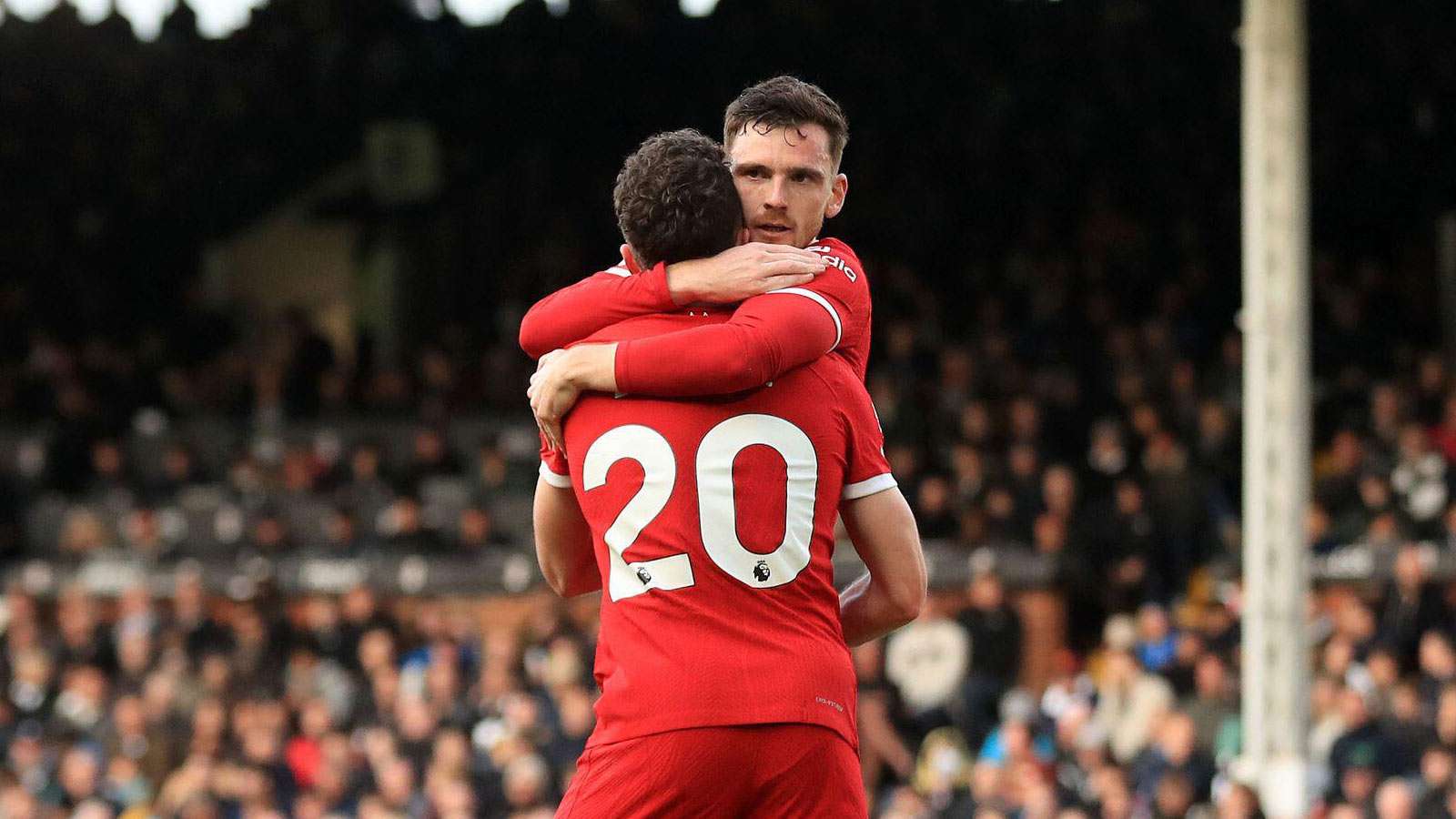 Andy Robertson hugs Diogo Jota