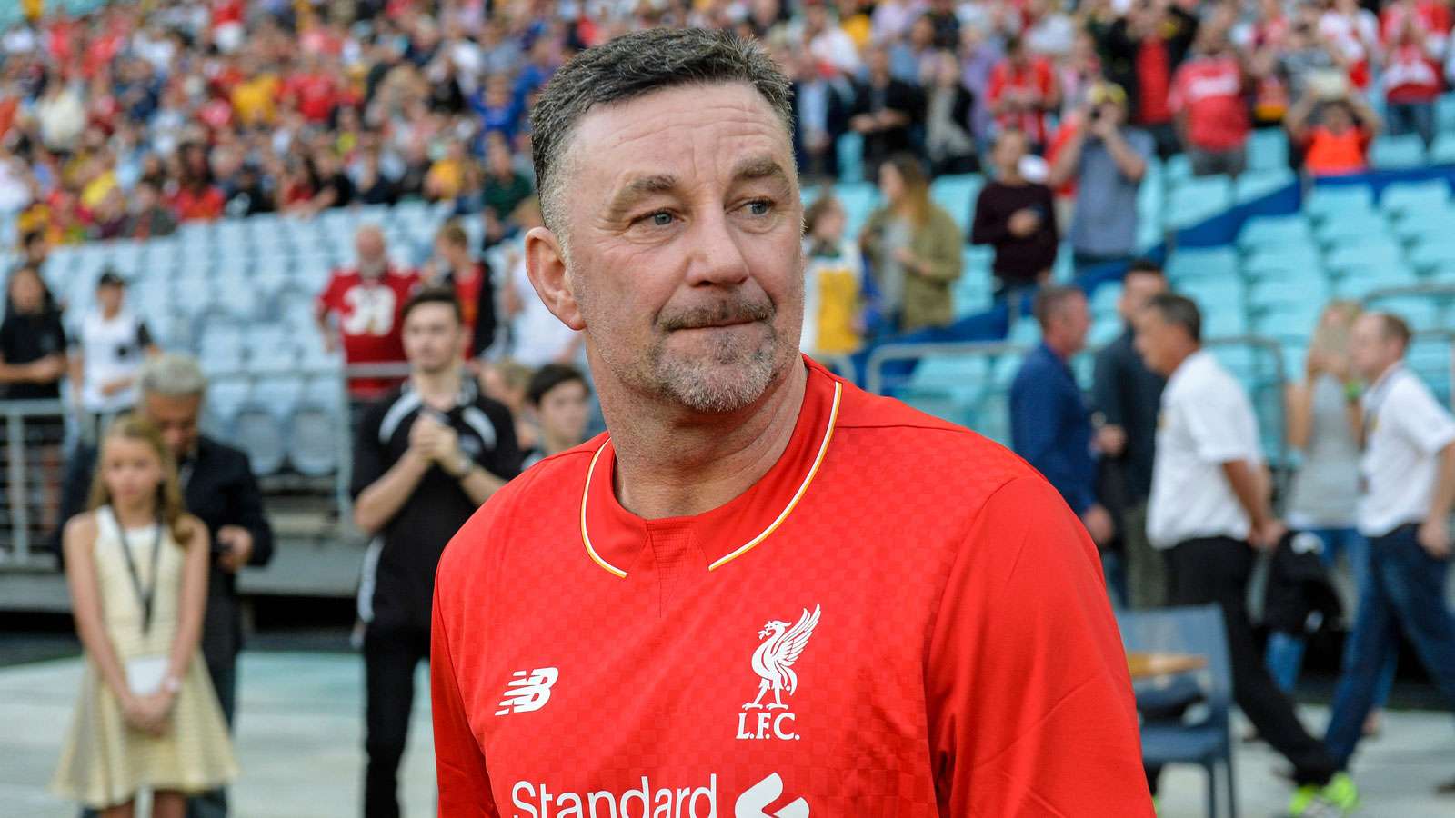 John Aldridge enters the pitch before a match Liverpool Legends and Australian Legends