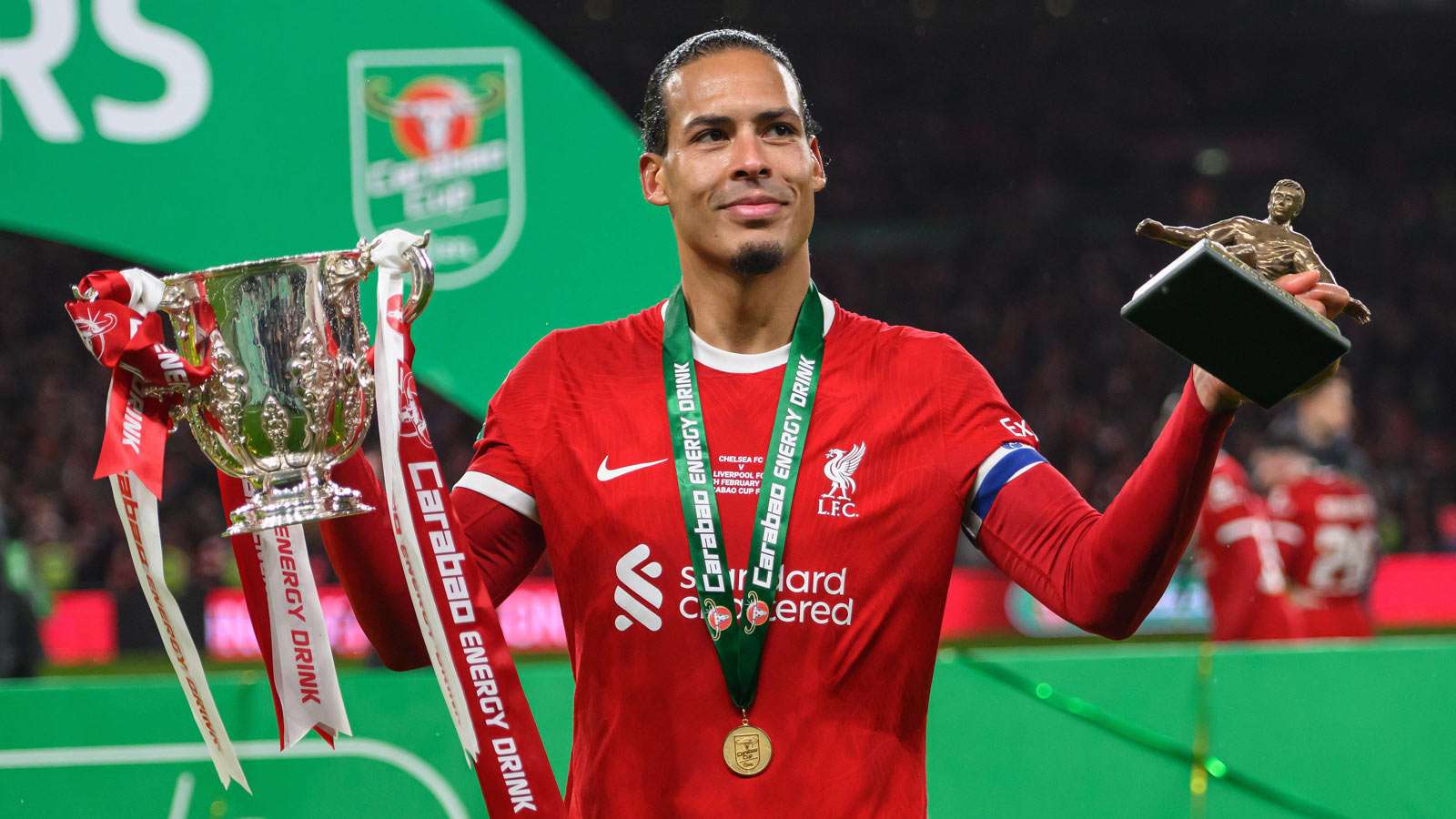 Virgil van Dijk celebrates with the Carabao Cup, 2024