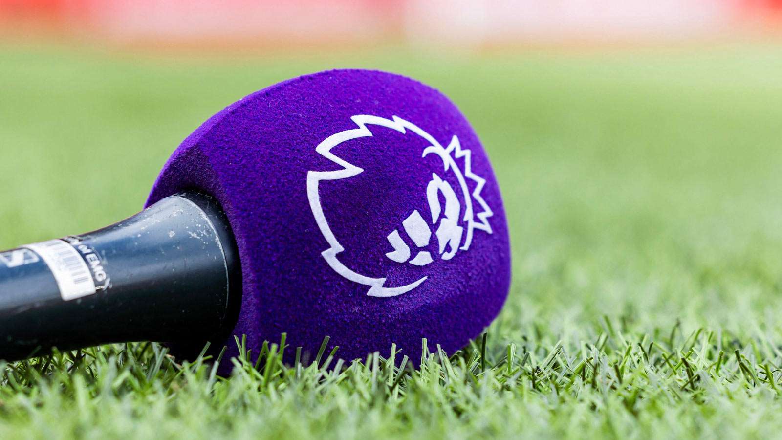 Premier League microphone sitting on turf