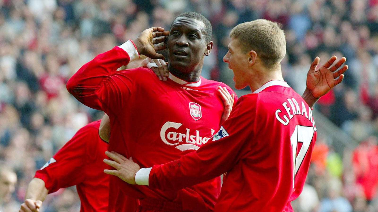 Emile Heskey celebrates with Steven Gerrard
